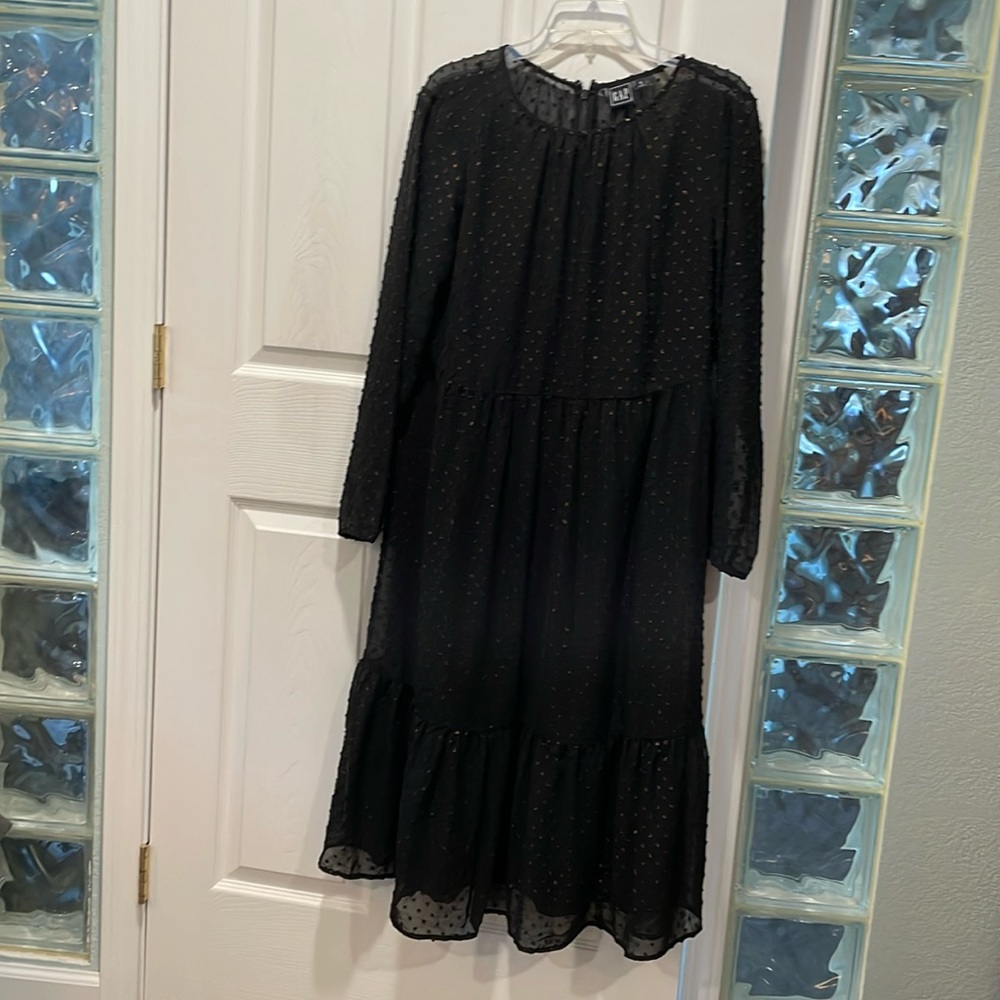 Black and coppery dotted tiered dress with attached slip.